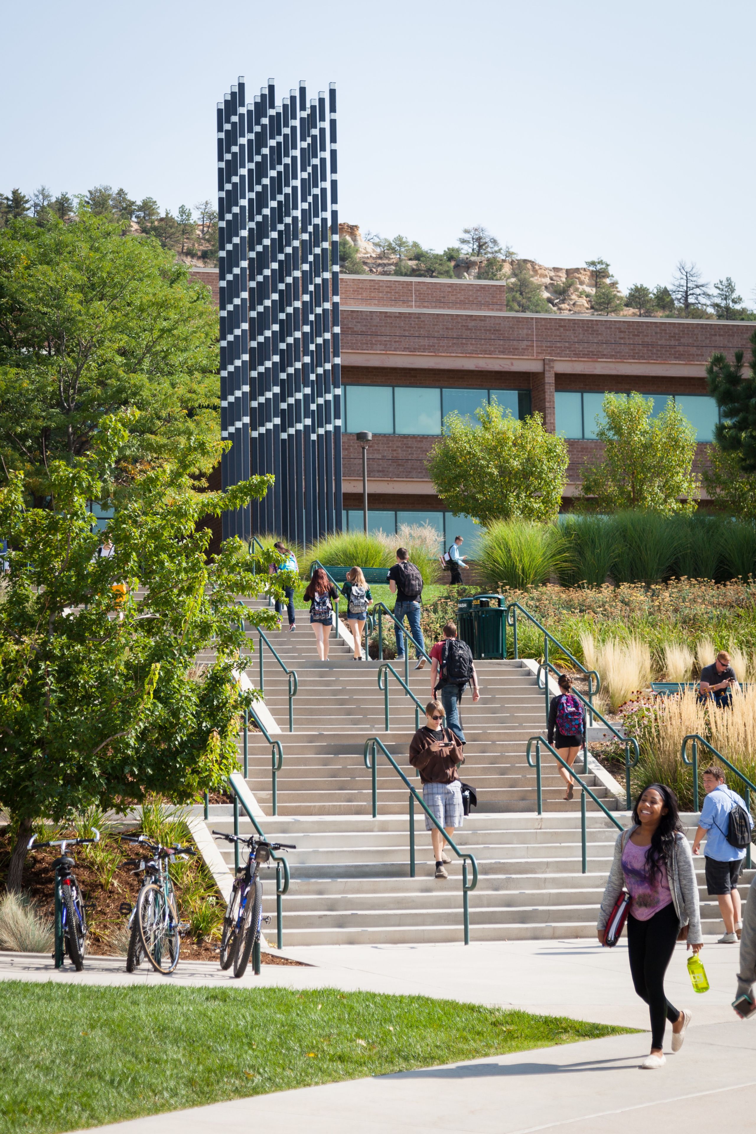 Photo of students walking up staircase on campus.